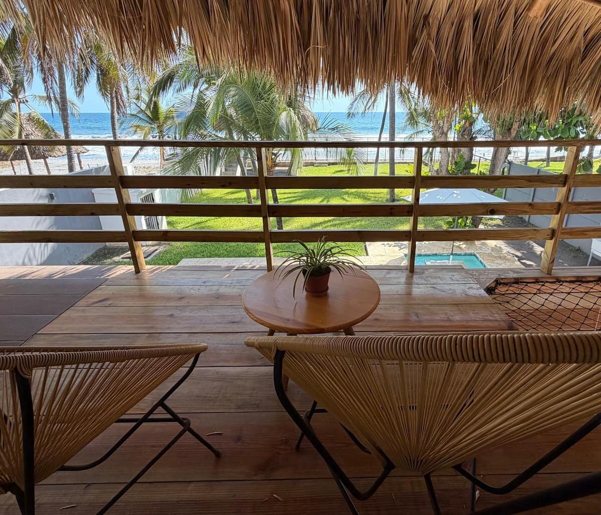 Private balcony overlooking the pool and ocean