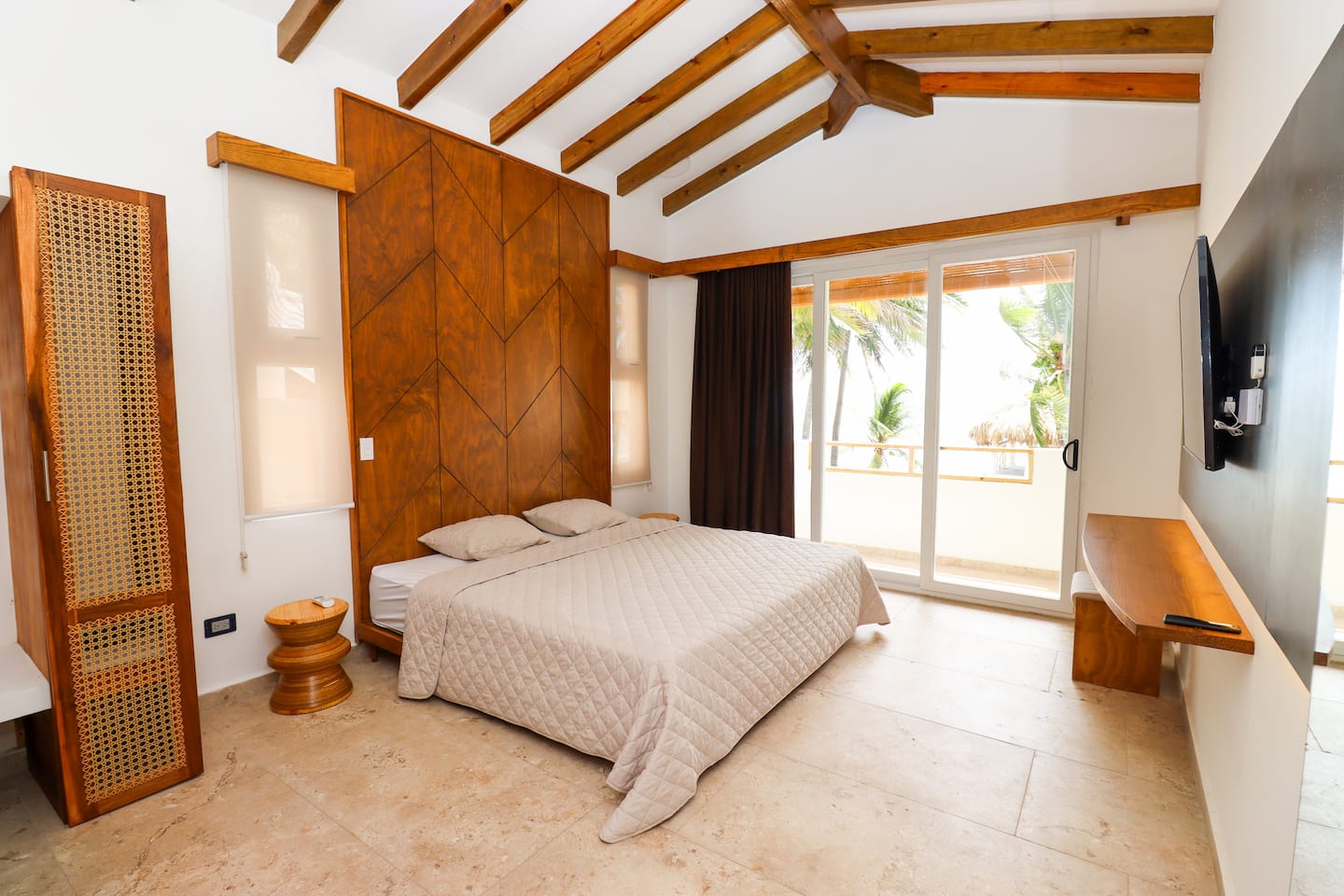 Master bedroom with king bed and balcony view
