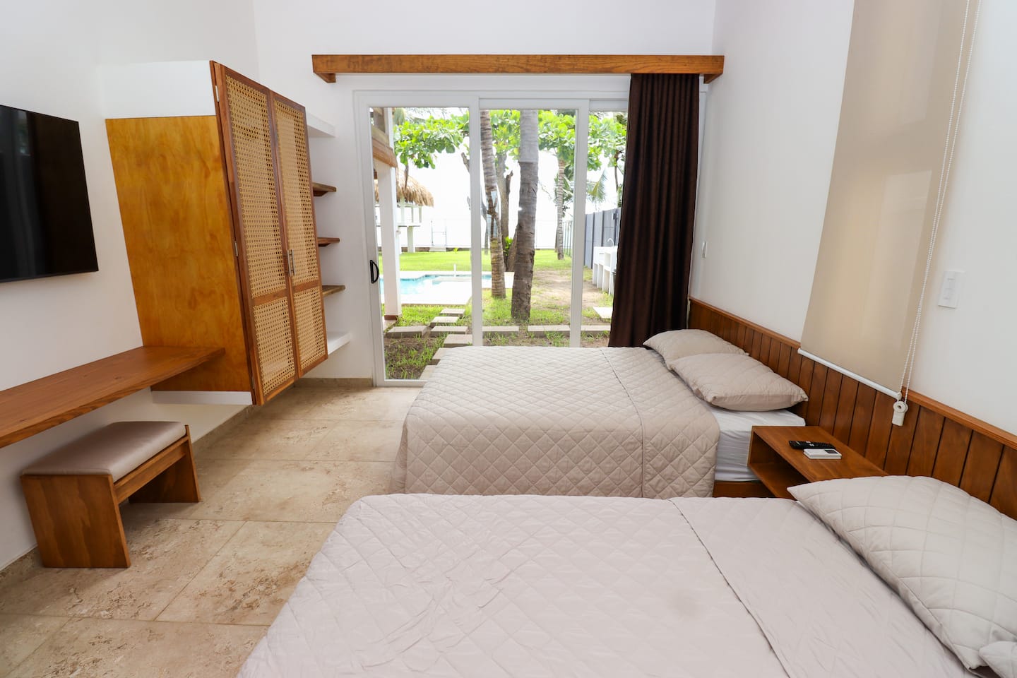 Bedroom 3 with two double beds and garden light